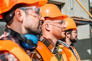 Three men supervising of civil engineering work