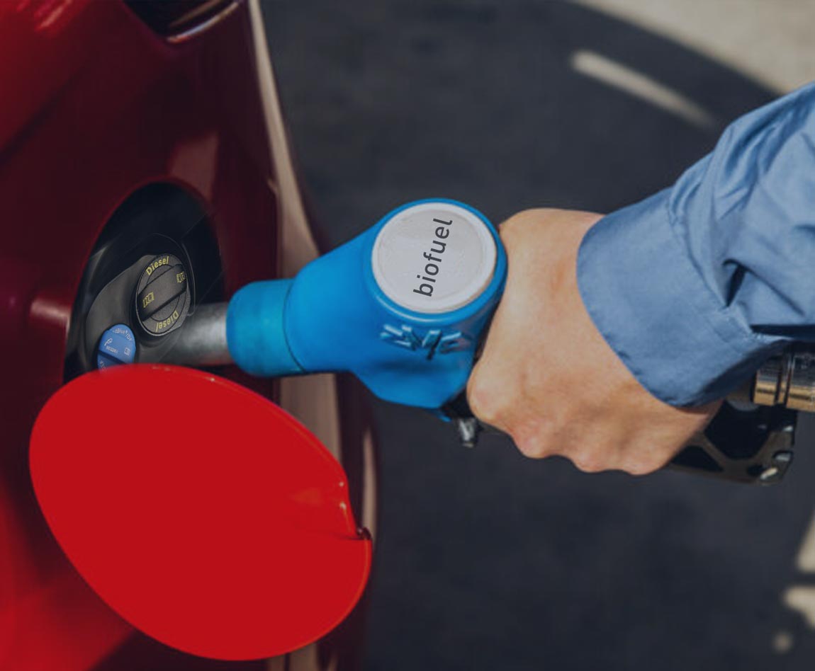 man filling his tank with AdBlue alternative fuel