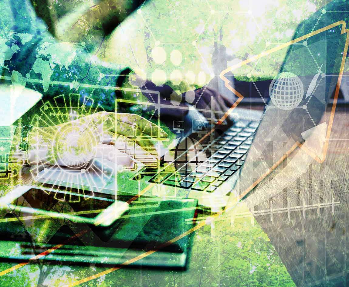 A man on a computer with a green background of nature