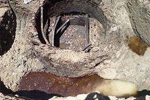 smoke escaping from several factory chimneys