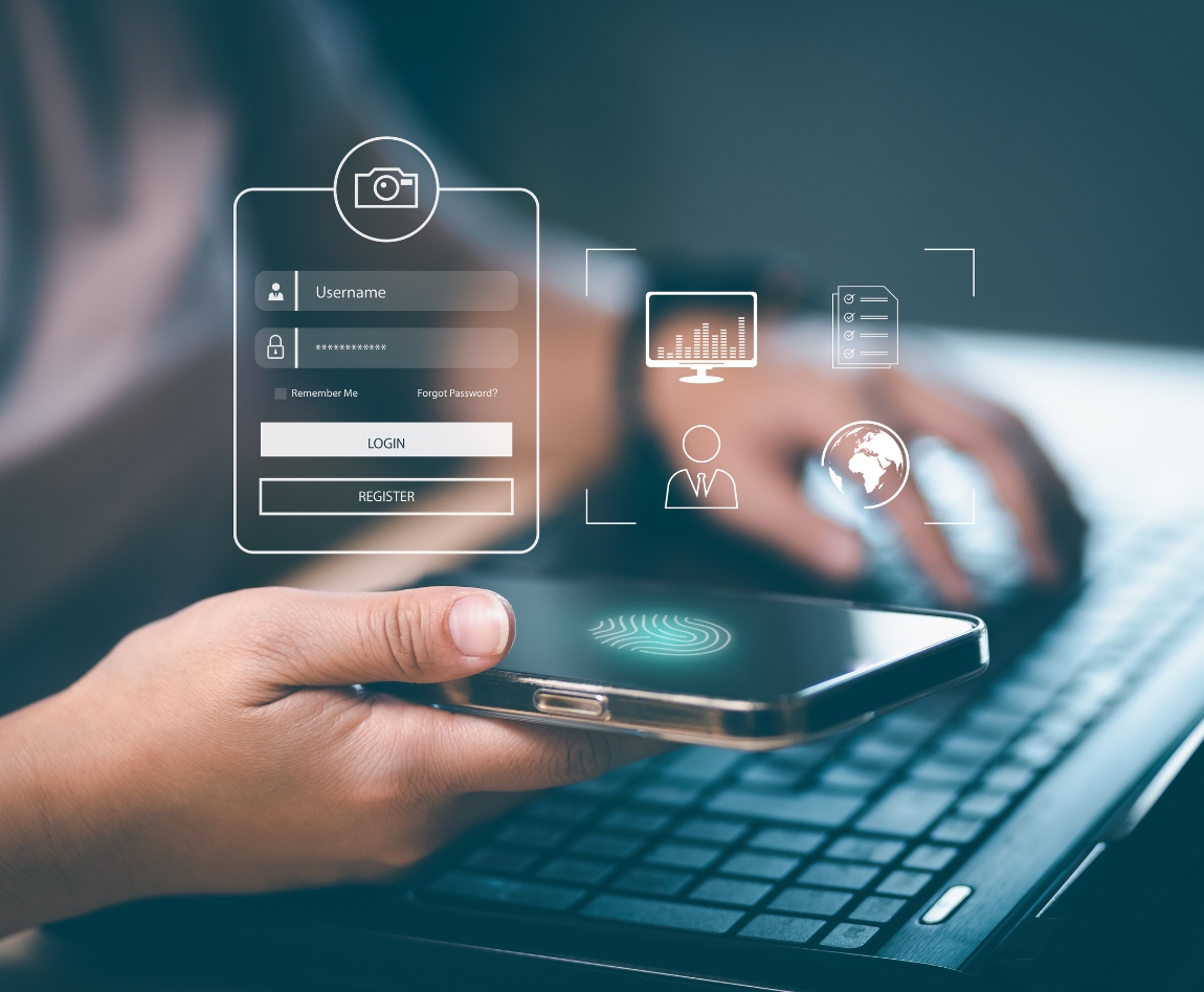 Main tenant un smartphone avec interface de connexion et empreinte digitale, devant un ordinateur portable, illustrant la cybersécurité et l'authentification.