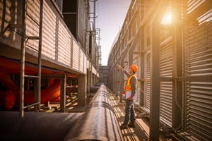 Apave employee inspecting a pipeline