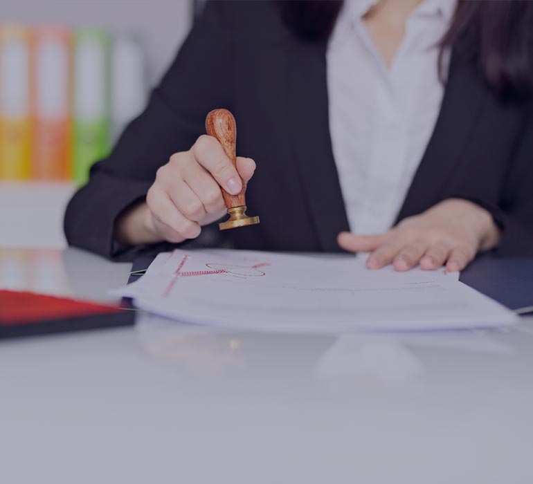 woman stamping an official document