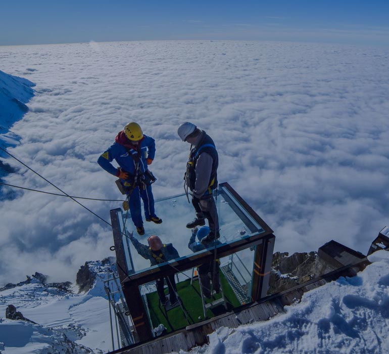 workers on top of a mountain