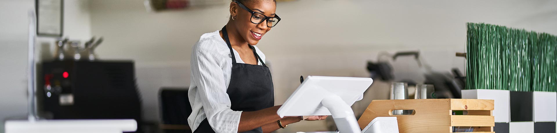 A woman behind a counter