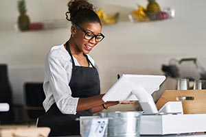 A woman behind a counter