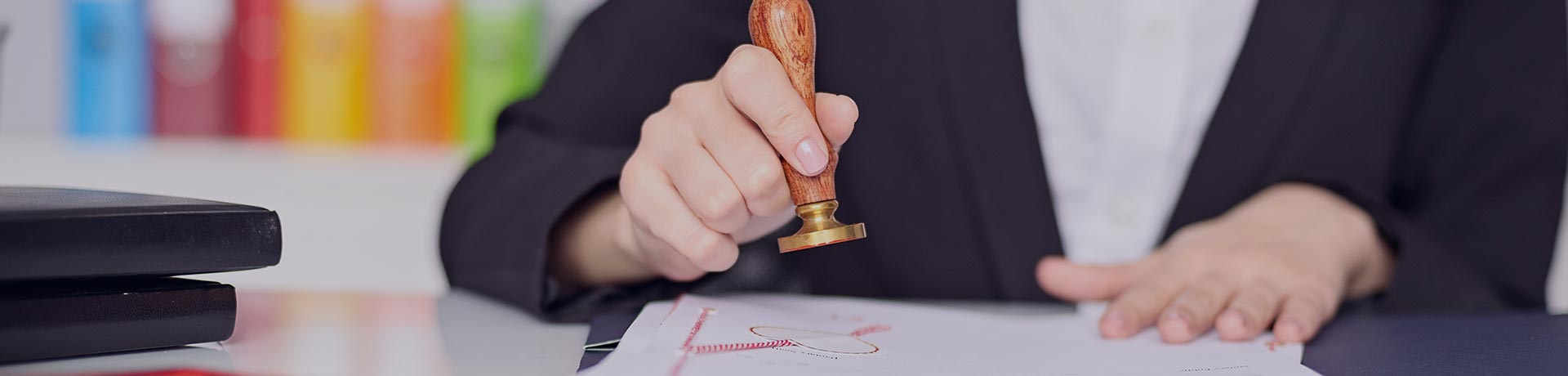 A woman stamping a document